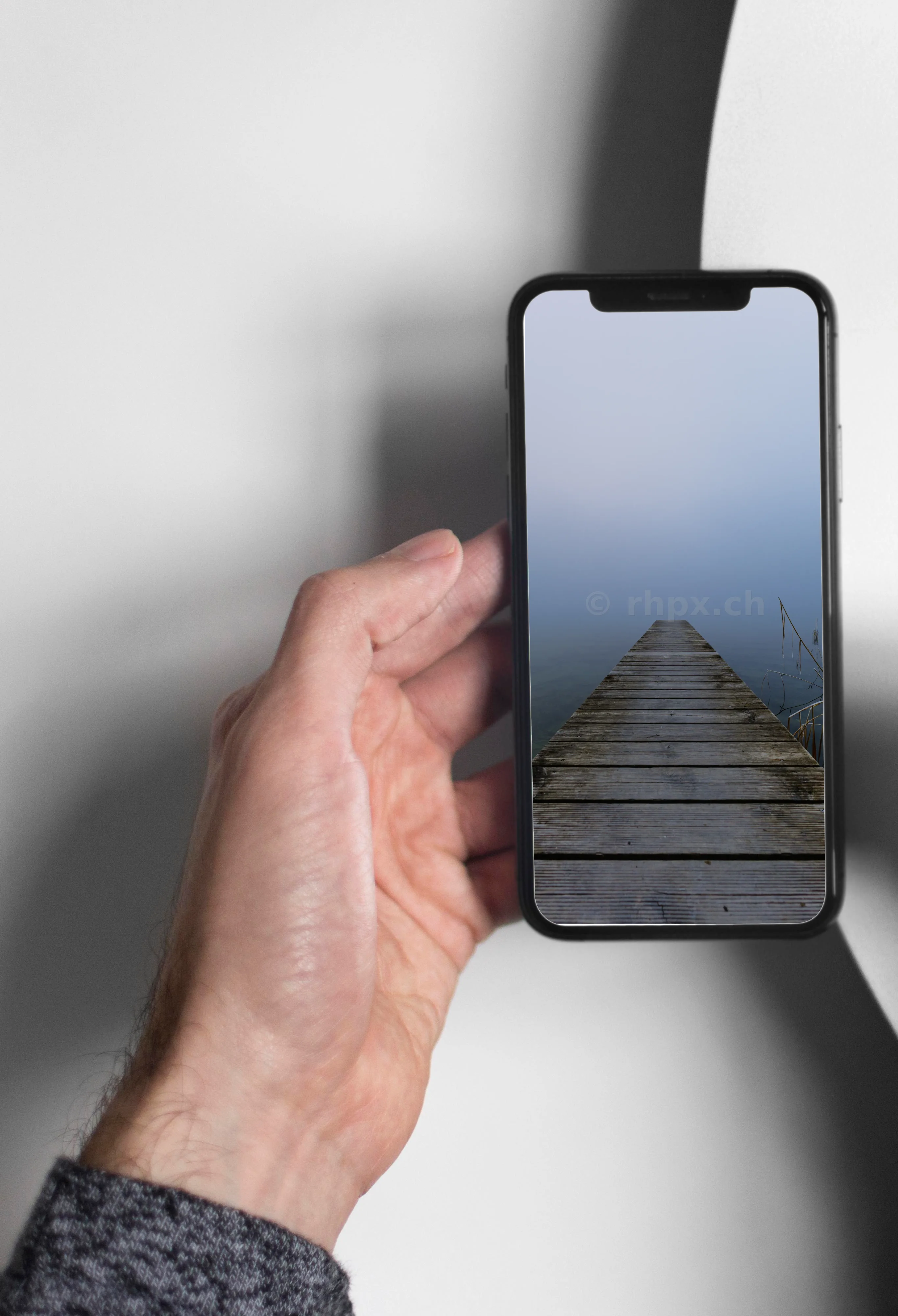 Wooden jetty at Lake Sempach in fog